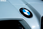 Exterior IND Painted BMW Roundel Set showing sleek, painted BMW logos on a reflective surface.