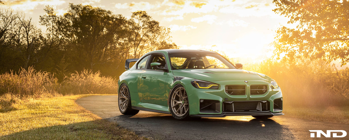 IND BMW G87 M2 front three-quarter view at sunrise