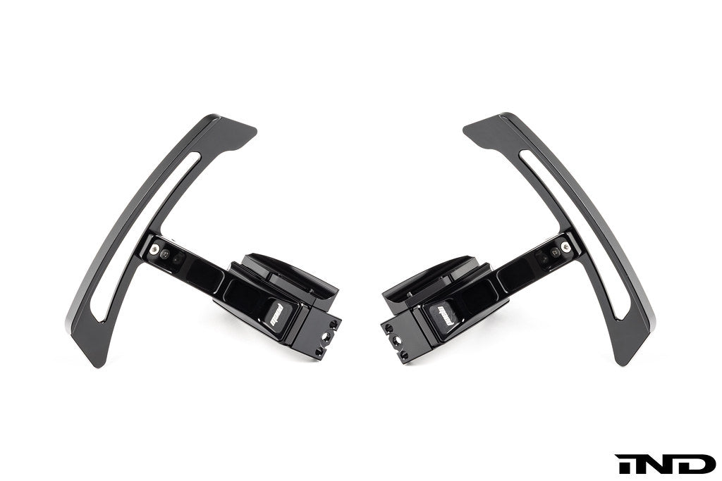 MAED Porsche 911 (992) billet magnetic shift paddle set installed inside the vehicle, white background, detailed close-up image.