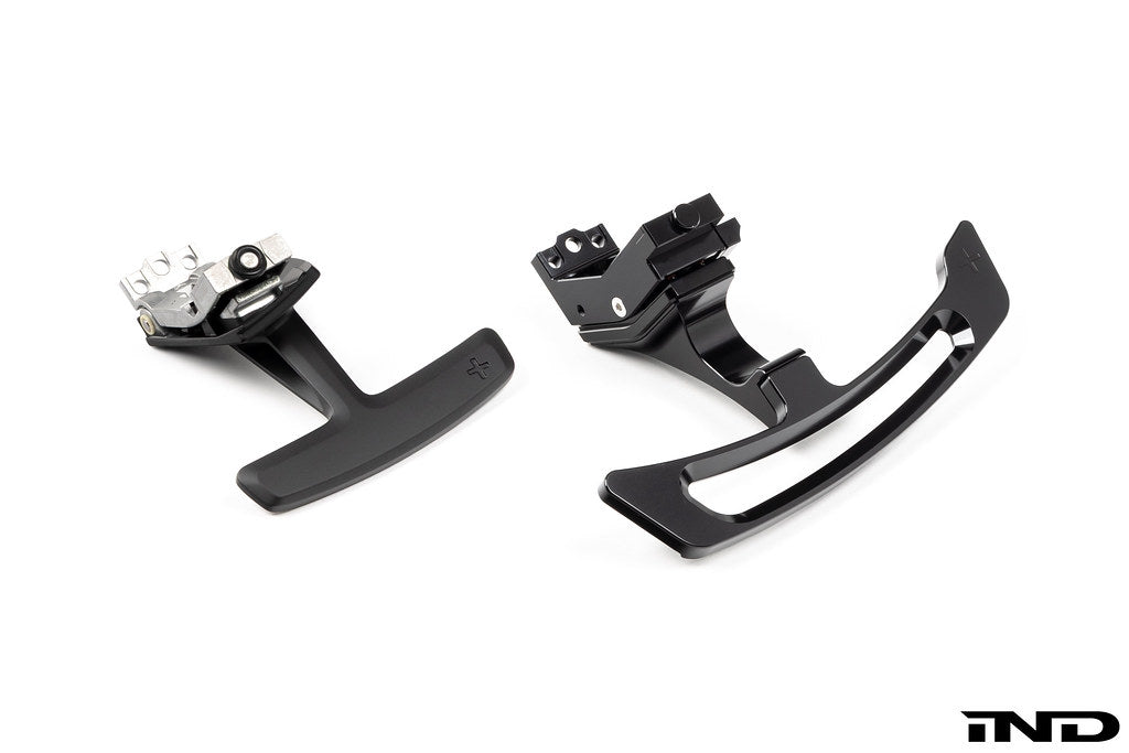 MAED Porsche 911 (992) billet magnetic shift paddle set installed in interior, white background, showcasing sleek white paddle design.