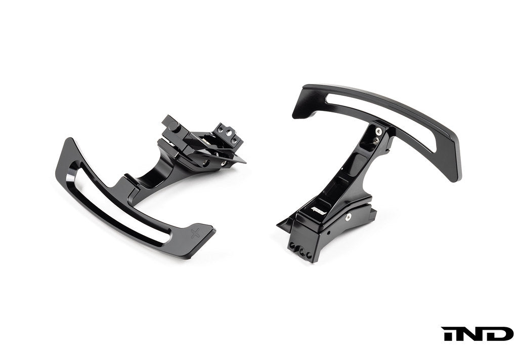 MAED Porsche 911 (992) billet magnetic shift paddle set installed in interior with white background.