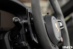 MAED Porsche 911 (992) billet magnetic shift paddle set installed in interior, featuring sleek metal design and ergonomic shape.