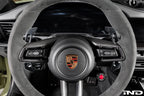 MAED Porsche 911 (992) billet magnetic shift paddle set installed inside the car interior, showing sleek metal design and mounting details.