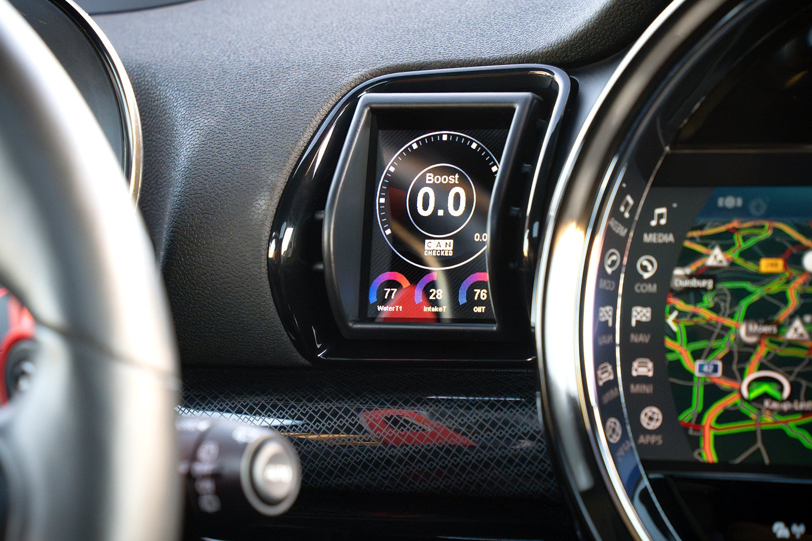 CANchecked MFD28 Gen2 2.8-inch multi-function display installed in a left-hand drive MINI F54 Clubman, featuring a vehicle-specific dashboard integration.