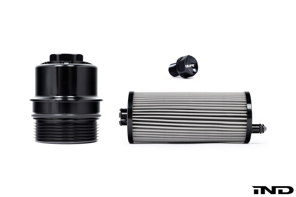 Black billet aluminum oil filter housing for BMW S58 engine, part of MMX Performance's lifetime oil service kit.
