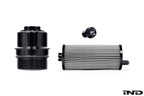 Black billet aluminum oil filter housing for BMW S58 engine, part of MMX Performance's lifetime oil service kit.
