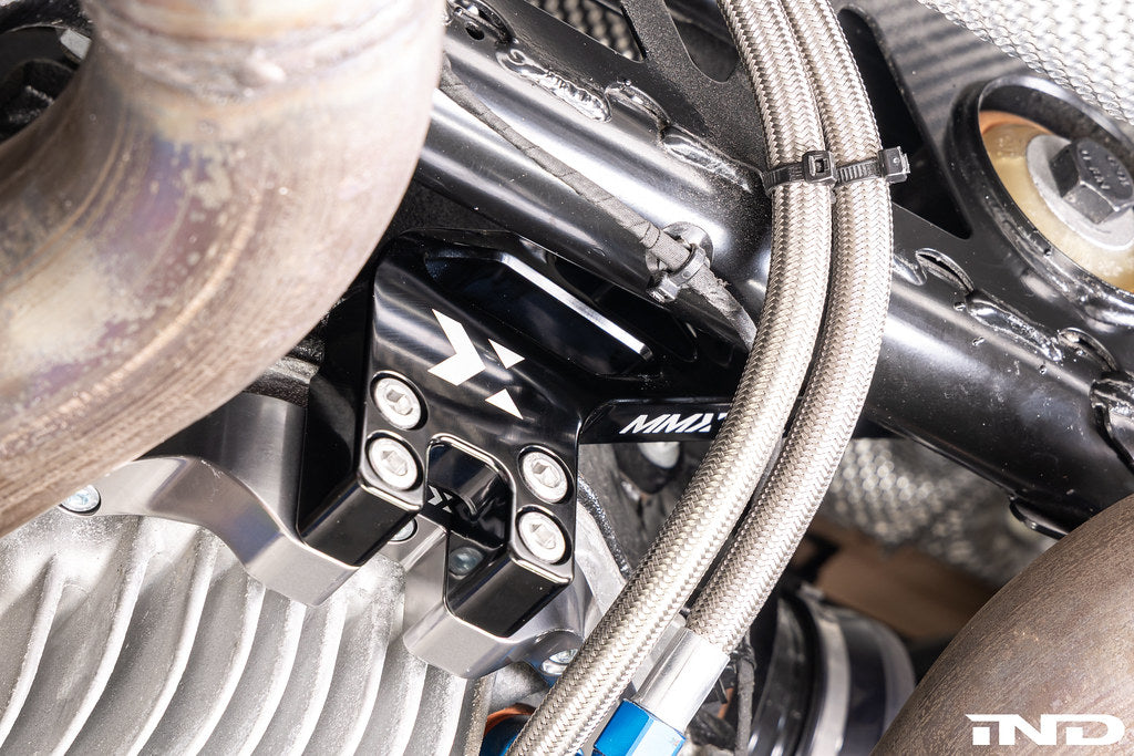 MMX Performance dual differential mount installed on BMW G87 M2 race car, engineered for the G8X M2, M3, and M4 platform to improve differential stability and drivetrain performance under high-load driving conditions.