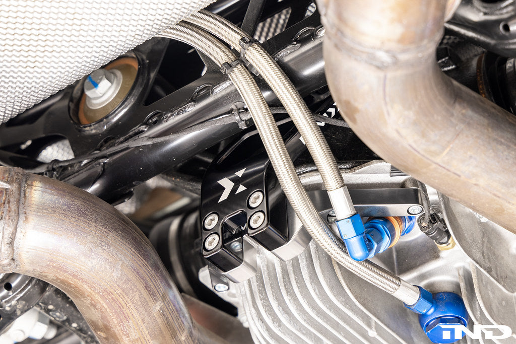 MMX Performance dual differential mount installed on BMW G87 M2 race car, engineered for the G8X M2, M3, and M4 platform to improve differential stability and drivetrain performance under high-load driving conditions.