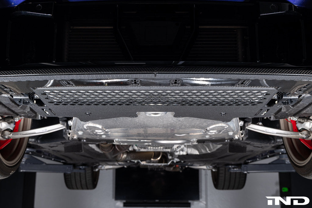 MMX Performance G8X M2 M3 M4 Oil Cooler Guard installed on a BMW G87 M2, G80 G81 M3, or G82 G83 M4, protecting the factory underbody oil cooler from road debris and track hazards while maintaining optimal airflow.