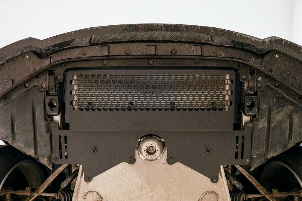 MMX Performance G8X M2 M3 M4 Oil Cooler Guard installed on a BMW G87 M2, G80 G81 M3, or G82 G83 M4, protecting the factory underbody oil cooler from road debris and track hazards while maintaining optimal airflow.