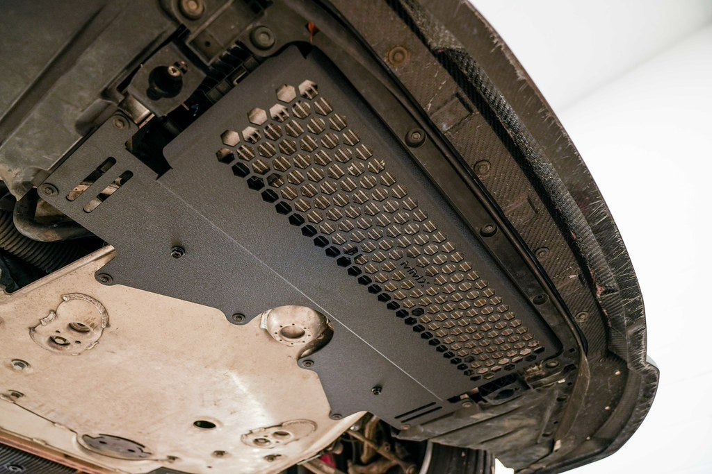 MMX Performance G8X M2 M3 M4 Oil Cooler Guard installed on a BMW G87 M2, G80 G81 M3, or G82 G83 M4, protecting the factory underbody oil cooler from road debris and track hazards while maintaining optimal airflow.