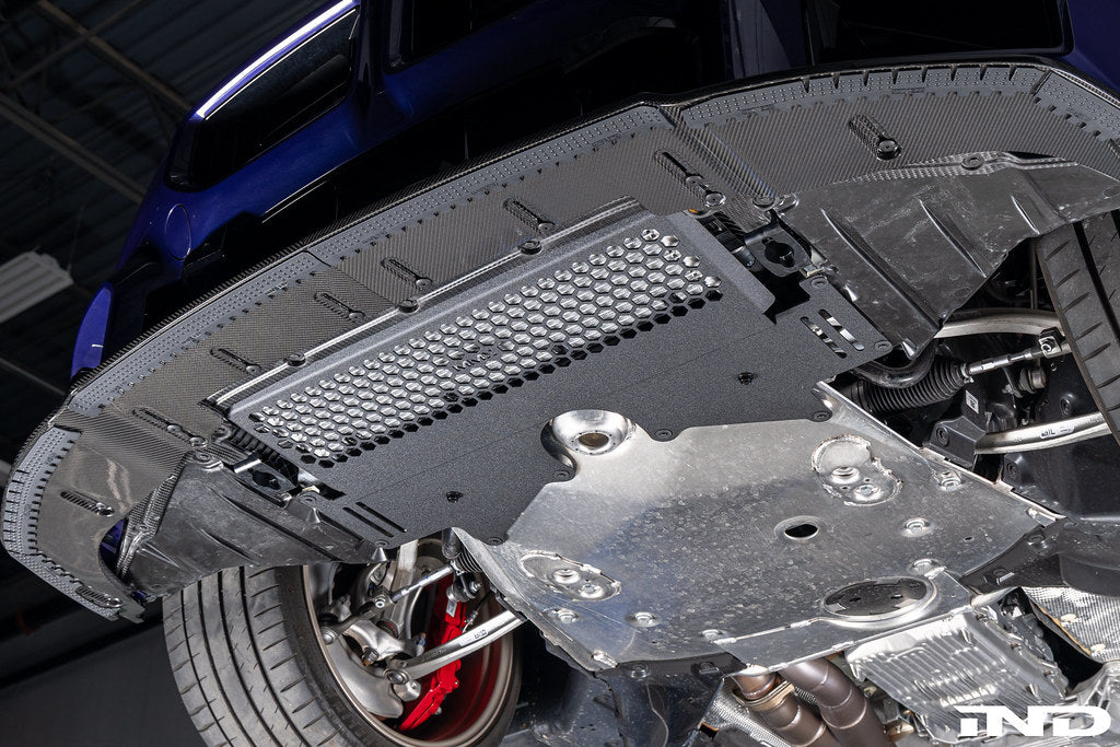 MMX Performance G8X M2 M3 M4 Oil Cooler Guard installed on a BMW G87 M2, G80 G81 M3, or G82 G83 M4, protecting the factory underbody oil cooler from road debris and track hazards while maintaining optimal airflow.