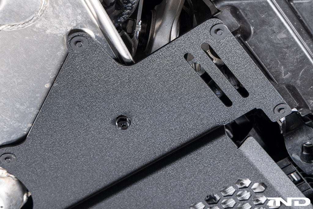 MMX Performance G8X M2 M3 M4 Oil Cooler Guard installed on a BMW G87 M2, G80 G81 M3, or G82 G83 M4, protecting the factory underbody oil cooler from road debris and track hazards while maintaining optimal airflow.