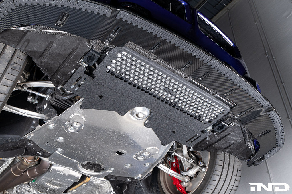 MMX Performance G8X M2 M3 M4 Oil Cooler Guard installed on a BMW G87 M2, G80 G81 M3, or G82 G83 M4, protecting the factory underbody oil cooler from road debris and track hazards while maintaining optimal airflow.