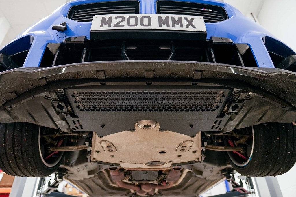 MMX Performance G8X M2 M3 M4 Oil Cooler Guard installed on a BMW G87 M2, G80 G81 M3, or G82 G83 M4, protecting the factory underbody oil cooler from road debris and track hazards while maintaining optimal airflow.