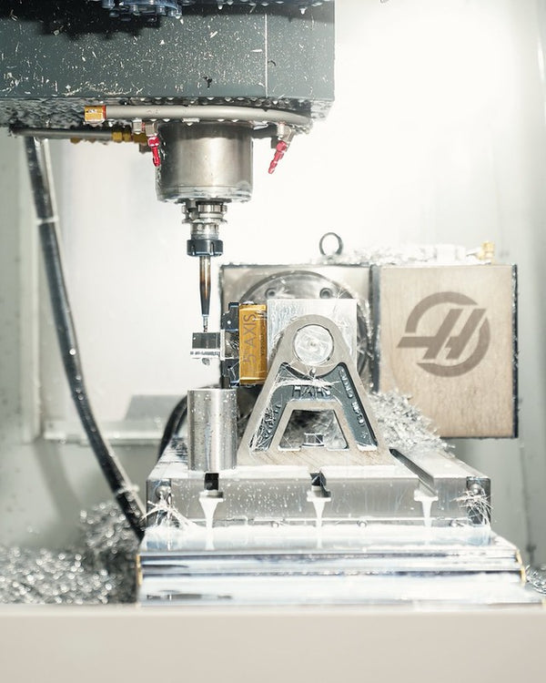 CNC machining process used in the development of MMX Performance products, showcasing UK design, engineering, and precision manufacturing standards