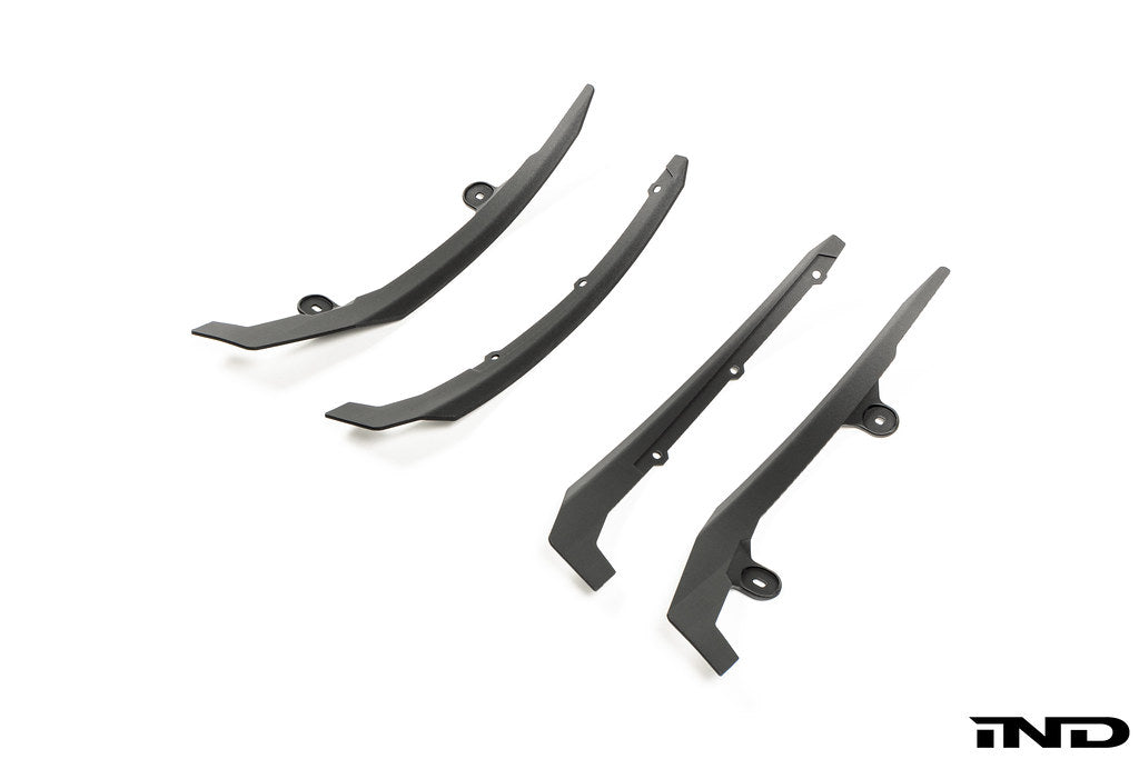 Megachip Aero Line Splash Guard Set for the BMW G87 M2 shown on a white background, featuring a carbon fiber-reinforced composite construction with an OEM+ matte finish for discreet paint protection.