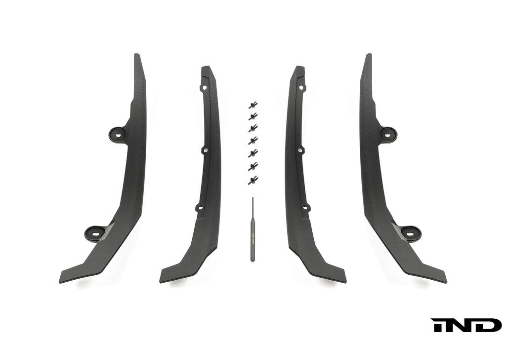 Megachip Aero Line Splash Guard Set for the BMW G87 M2 shown on a white background, featuring a carbon fiber-reinforced composite construction with an OEM+ matte finish for discreet paint protection.