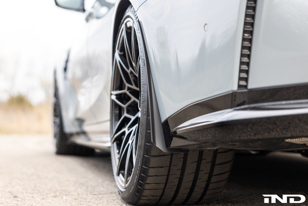 Megachip G8X M2, M3, M4 exterior splash guard set installed on vehicle, protecting wheels and undercarriage from debris.