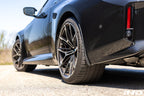 Megachip G8X M2 M3 M4 exterior splash guard set installed on vehicle, protecting wheels from mud and debris.