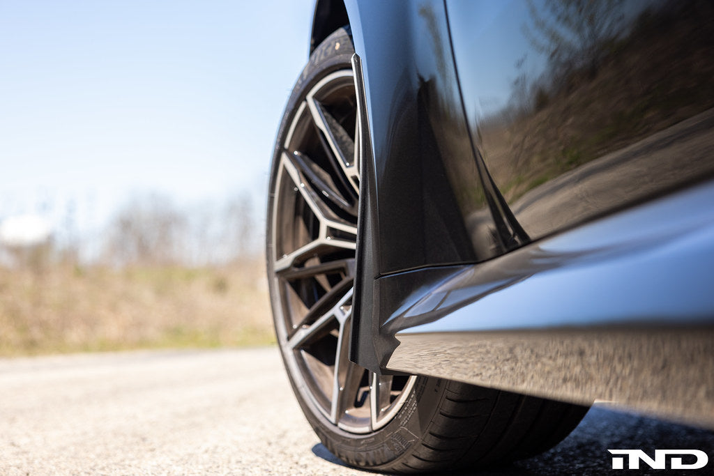 Megachip G8X M2/M3/M4 exterior splash guard set installed on vehicle's wheel area, protecting against road debris.