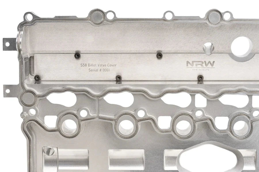 Close-up of NRW-Design BMW S58 billet valve cover showing its sleek, durable metal finish and detailed craftsmanship for performance engines.