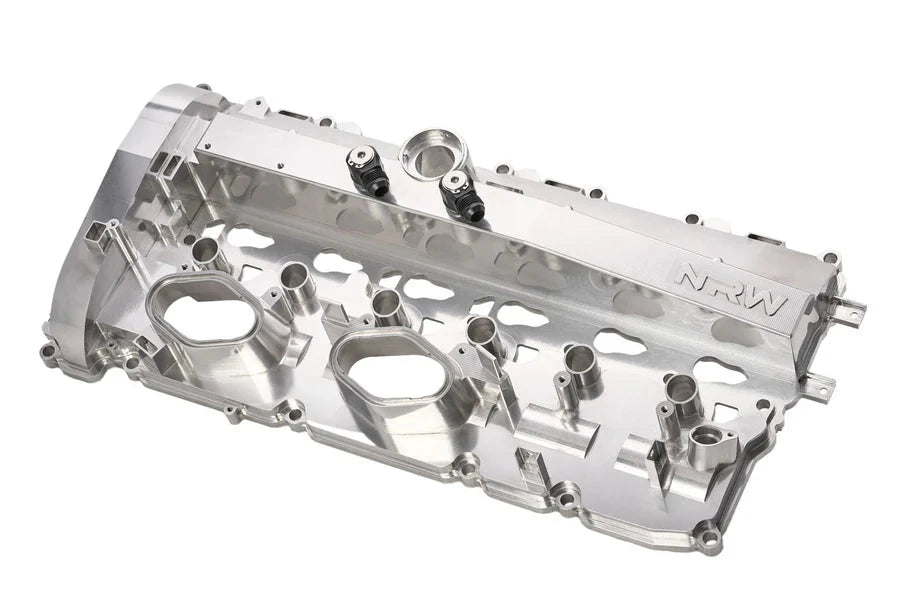 NRW-Design BMW S58 billet valve cover for performance engine, shown in a sleek, polished metal finish.