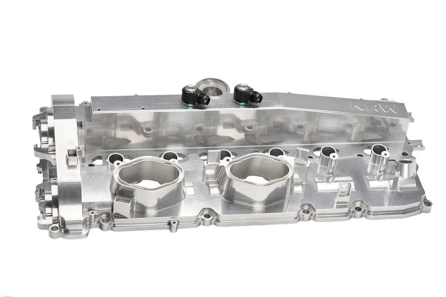 NRW-Design BMW S58 billet valve cover shown from reverse side, showcasing sleek performance design and polished metal finish.