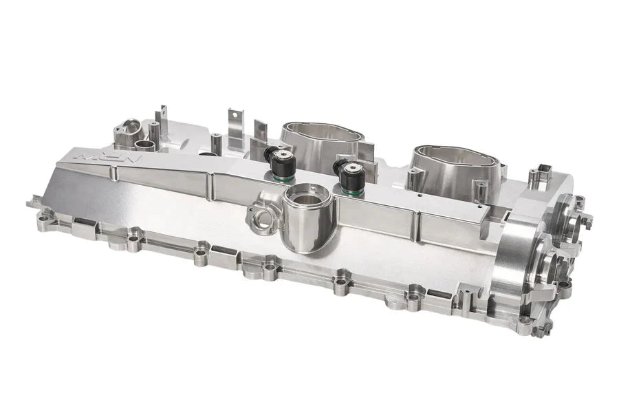 NRW-Design BMW S58 billet valve cover showing side profile with polished metal finish and performance engine details.