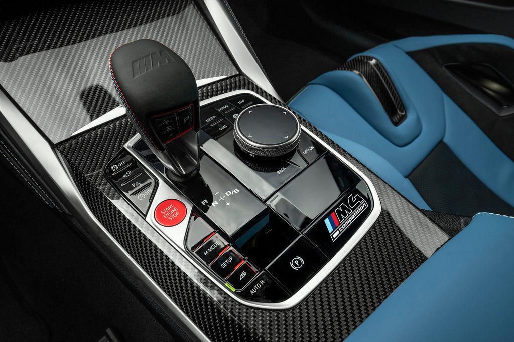 BMW G82 G83 M4 Competition interior control panel nameplate on the dashboard, featuring sleek branding and modern design.
