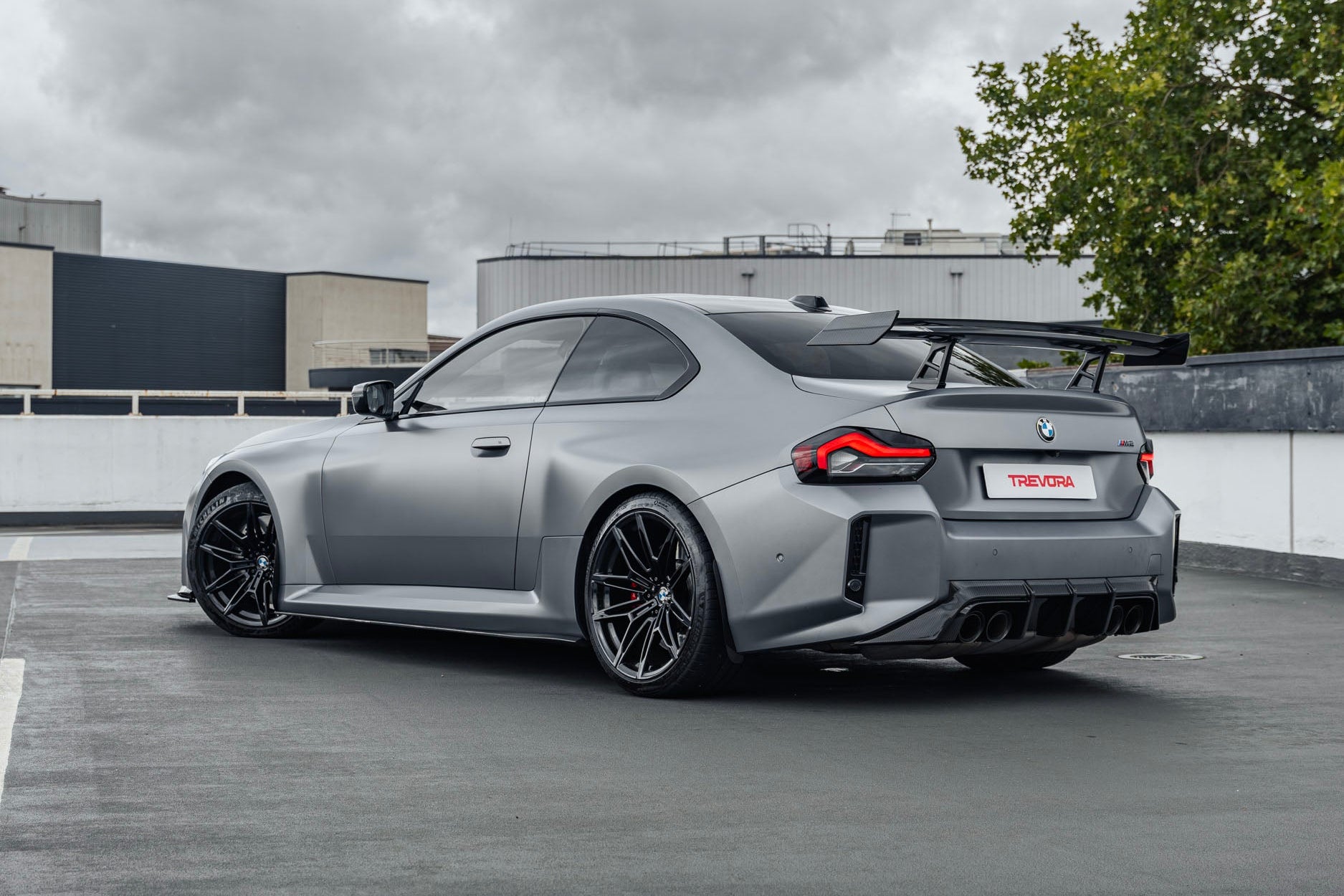 TREVORA G87 M2 TR87 Track Pack Adjustable Rear Wing installed on a BMW G87 M2, featuring a twin-plane pre-preg carbon fibre design engineered to increase aerodynamic efficiency and rear downforce.