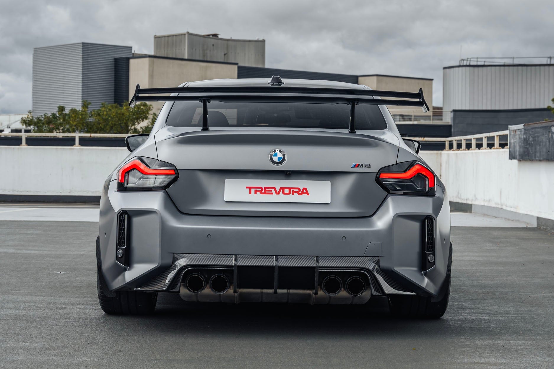TREVORA G87 M2 TR87 Track Pack Adjustable Rear Wing installed on a BMW G87 M2, featuring a twin-plane pre-preg carbon fibre design engineered to increase aerodynamic efficiency and rear downforce.