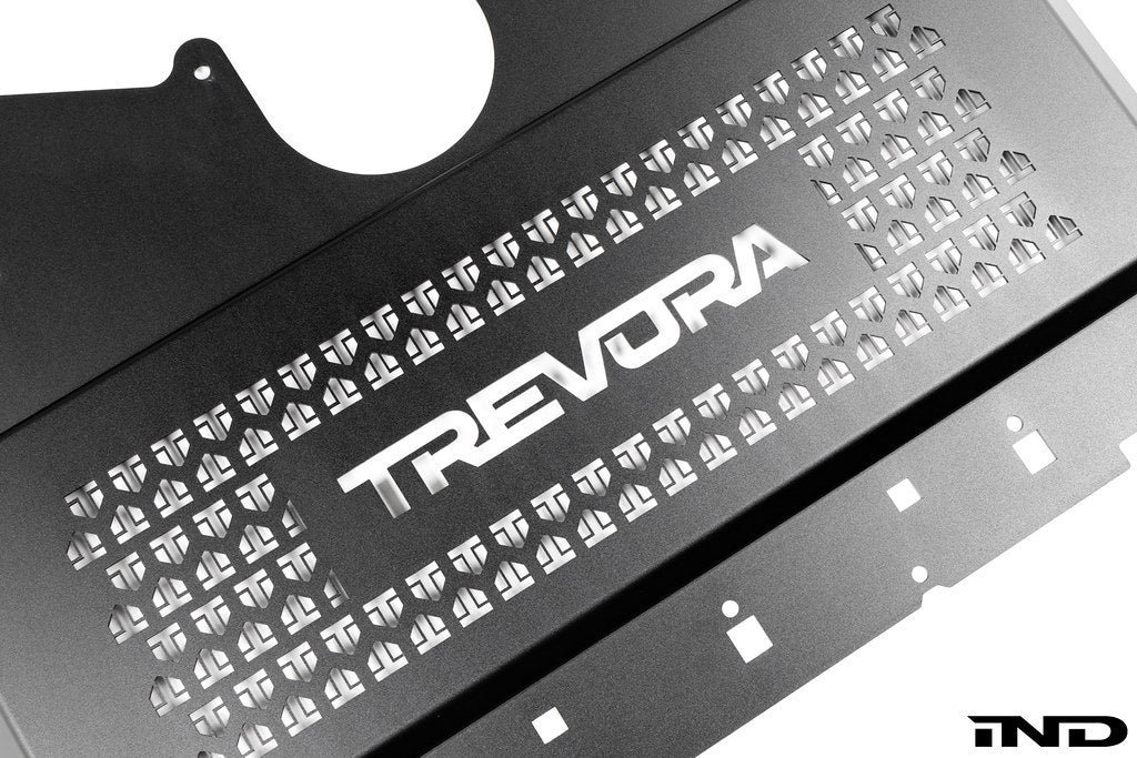 TREVORA G8X M2 M3 M4 metal skid plate under tray designed to protect the underside of the vehicle from road and track debris, shown on a white background.