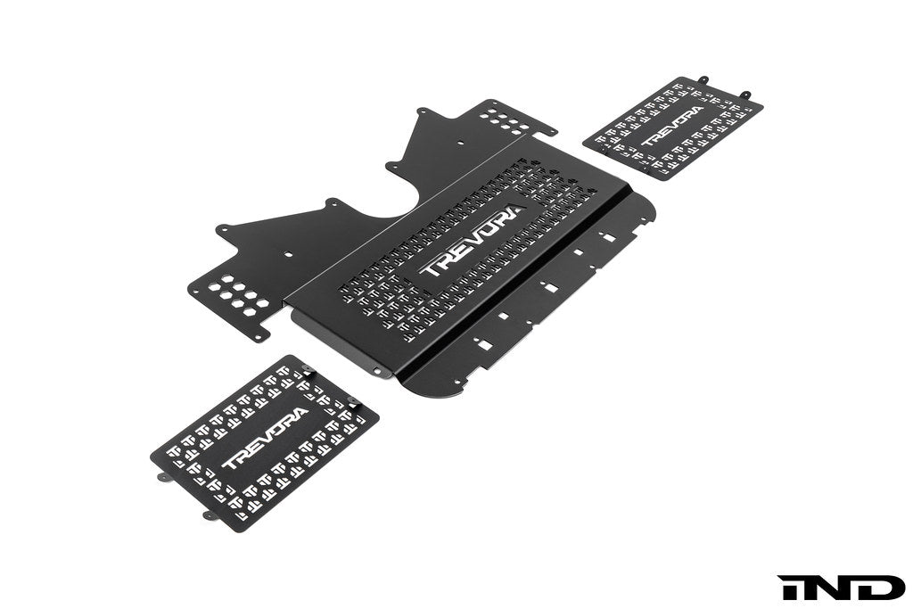 TREVORA G8X M2 M3 M4 Metal Skid Plate and Arch Clearance Kit shown on a white background, engineered to provide additional wheel arch clearance and underbody protection for BMW G87 M2, G80 M3, and G82 G83 M4 applications.