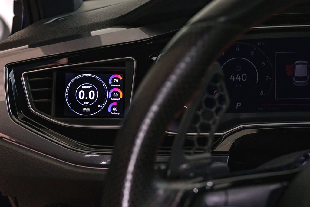 CANchecked MFD32 Gen2 3.2-inch multi-function display installed in a left-hand drive Volkswagen MK6 Polo, featuring a vehicle-specific dashboard integration.