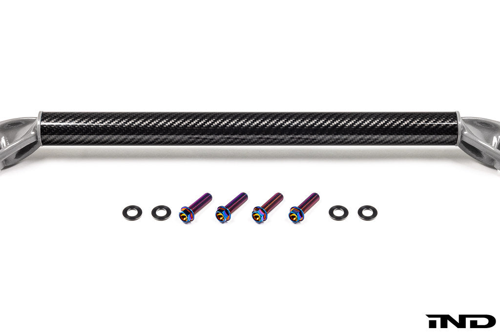 AptusWorks ACX A90 A91 Supra DMLS carbon strut brace for suspension, shown on a white background with detailed carbon fiber finish.