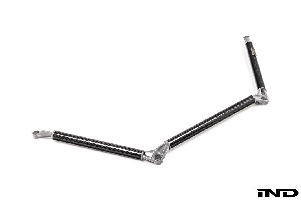 AptusWorks ACX A90 A91 MKV Supra DMLS carbon strut brace installed in a vehicle, showcasing its sleek white finish and structural design.