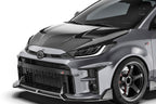 ADRO carbon fiber front lip installed on Toyota GR Yaris, showcasing sleek exterior design and aerodynamic enhancement.