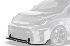 ADRO Toyota GR Yaris carbon fiber front lip installed, showcasing its sleek exterior design and aerodynamic enhancement from an angled view.