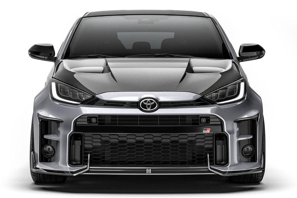 ADRO Toyota GR Yaris with carbon fiber front lip installed, showcasing sporty exterior upgrade on the front bumper.