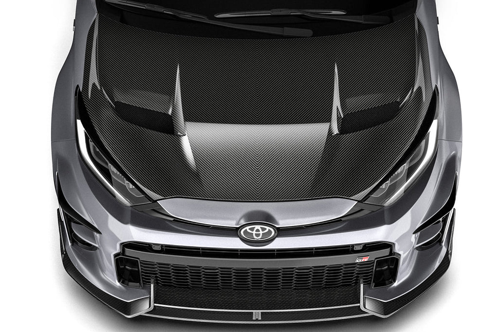 ADRO carbon fiber front lip installed on a Toyota GR Yaris, enhancing the vehicle's sporty exterior appearance.