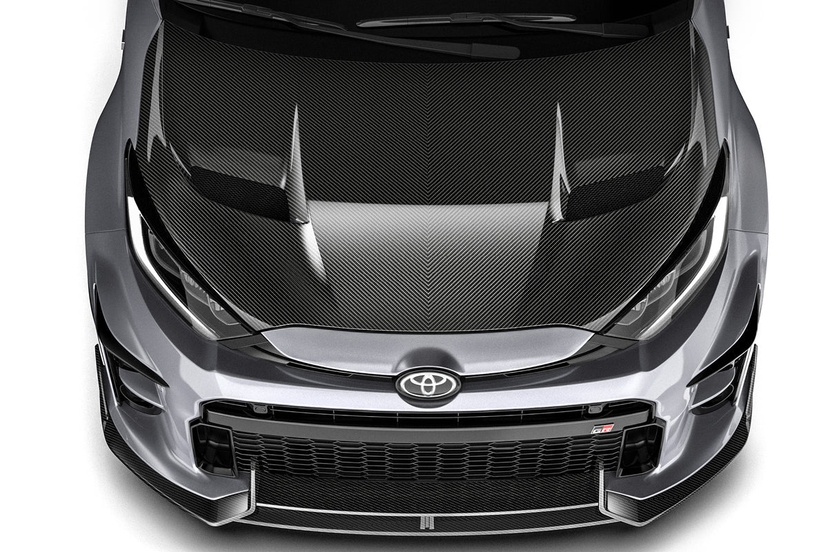 ADRO Toyota GR Yaris with prepreg carbon fiber hood installed, showcasing the lightweight, high-performance exterior upgrade.