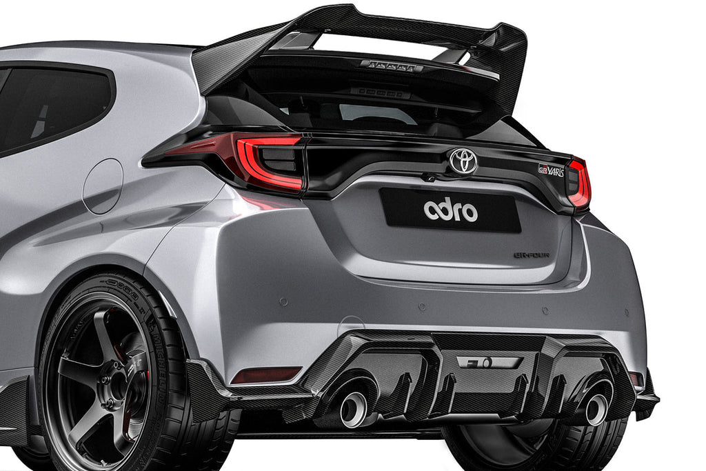 ADRO Toyota GR Yaris exterior with carbon fiber rear diffuser installed, showcasing aerodynamic design from a side angle.