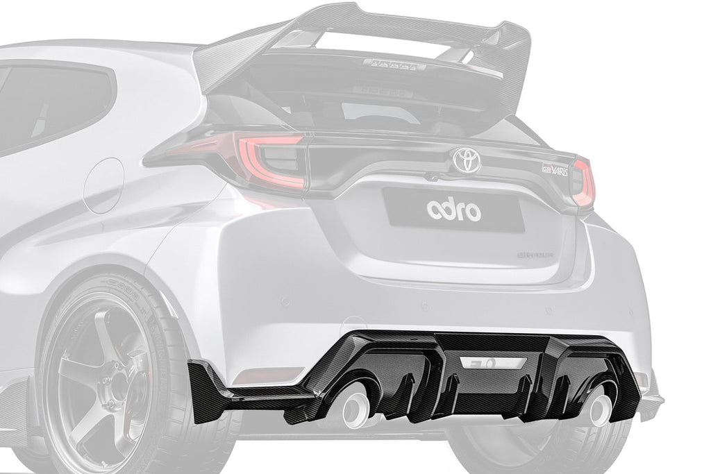 ADRO Toyota GR Yaris exterior carbon fiber rear diffuser installed, showcasing its aerodynamic design and textured finish.