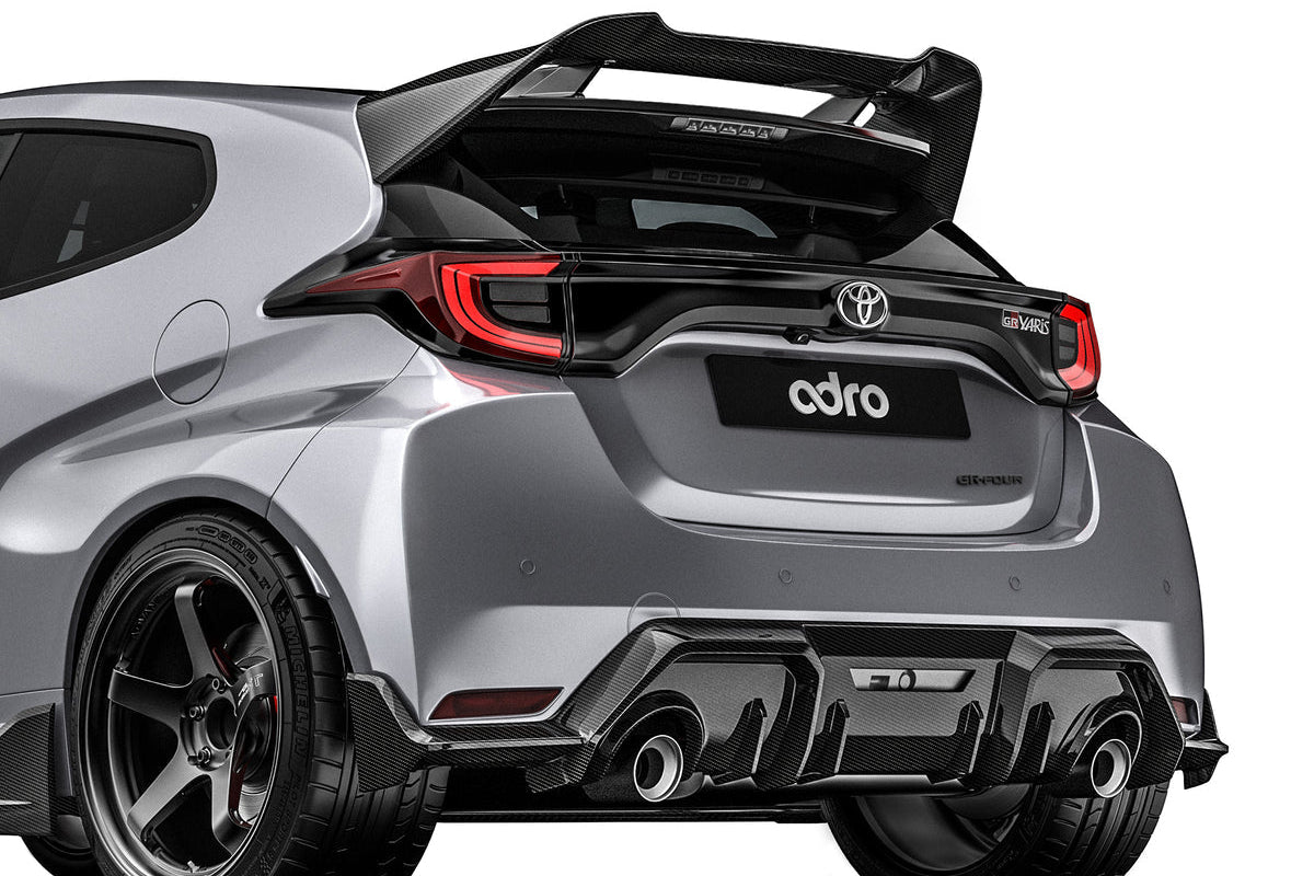 ADRO Toyota GR Yaris exterior carbon fiber spoiler installed, showcasing its sleek, lightweight design from an angled view.
