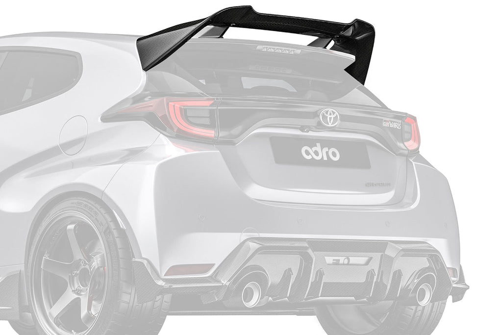 ADRO Toyota GR Yaris exterior with Prepreg carbon fiber spoiler installed, showcasing a sleek, aerodynamic design from an angled view.