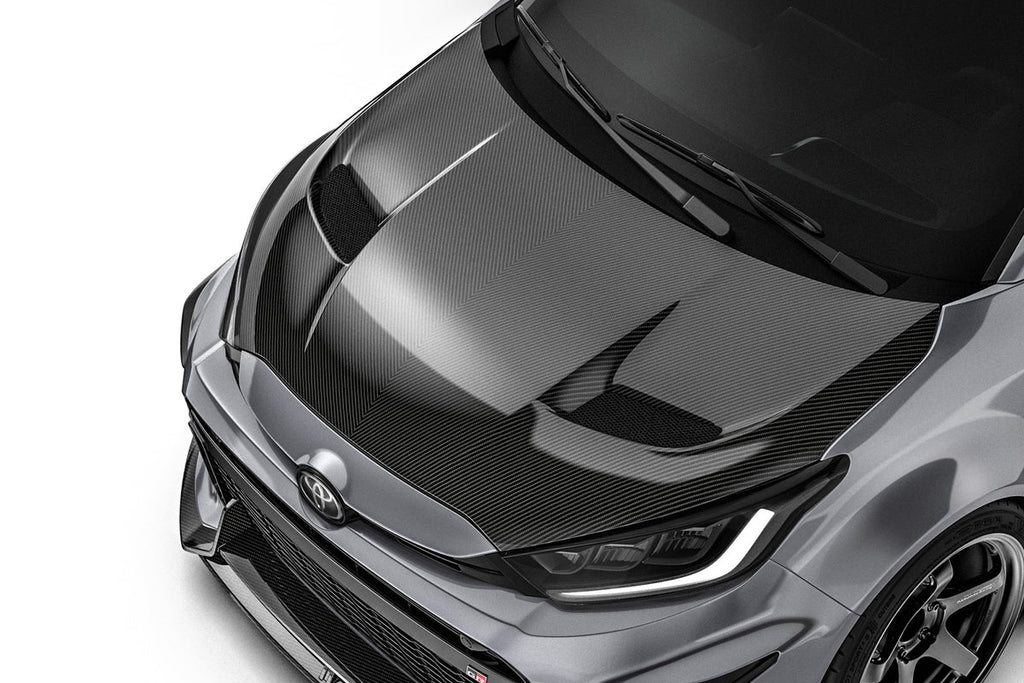 ADRO Toyota GR Yaris with prepreg carbon fiber hood showing vent detail, lightweight exterior upgrade for sporty performance.