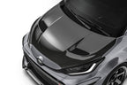 ADRO Toyota GR Yaris with prepreg carbon fiber hood showing vent detail, lightweight exterior upgrade for sporty performance.