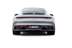 Akrapovič Porsche 992.1 Carrera GTS Dakar slip-on race exhaust with black tailpipes installed on the vehicle.