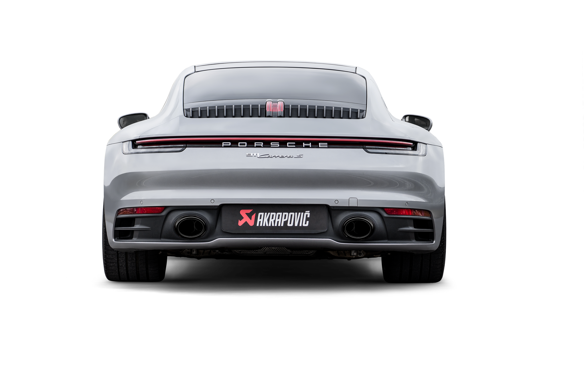 Akrapovič Porsche 992.1 Carrera GTS Dakar slip-on race exhaust with black tailpipes installed on the vehicle.